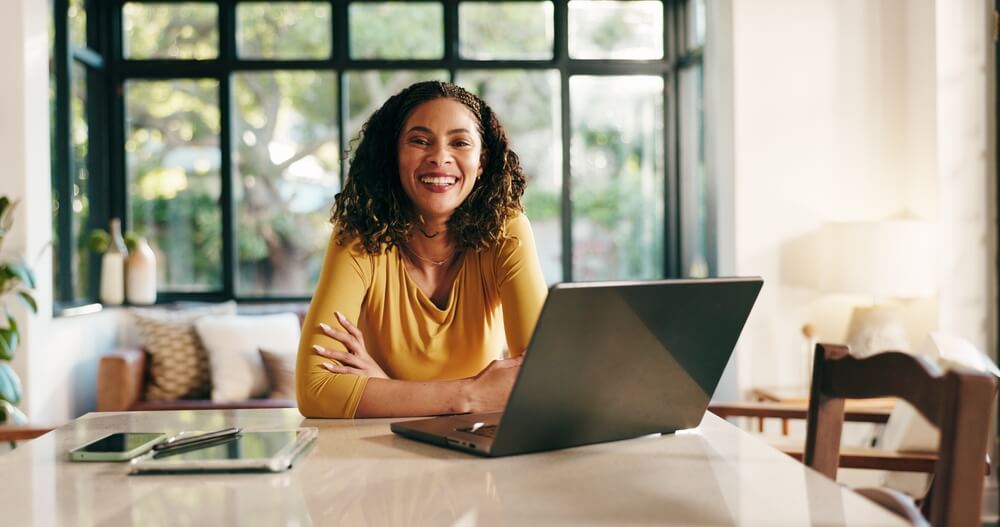 Remote virtual wellness assistant scheduling patient appointments and updating electronic health records from a home office workspace.