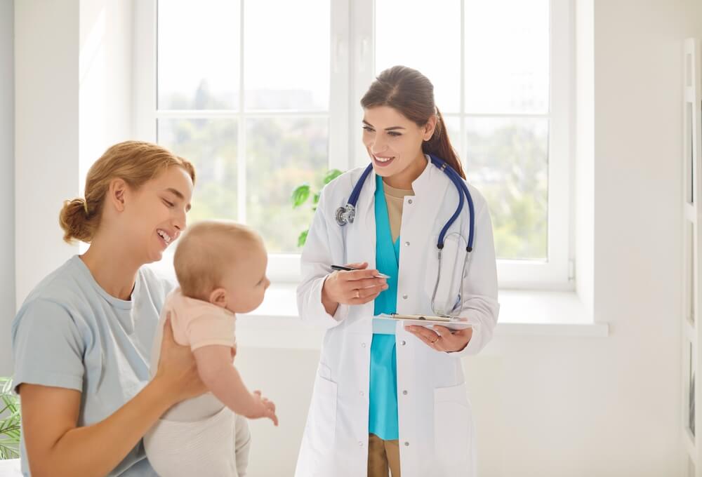 Certified family nurse practitioner examining a patient during a routine checkup